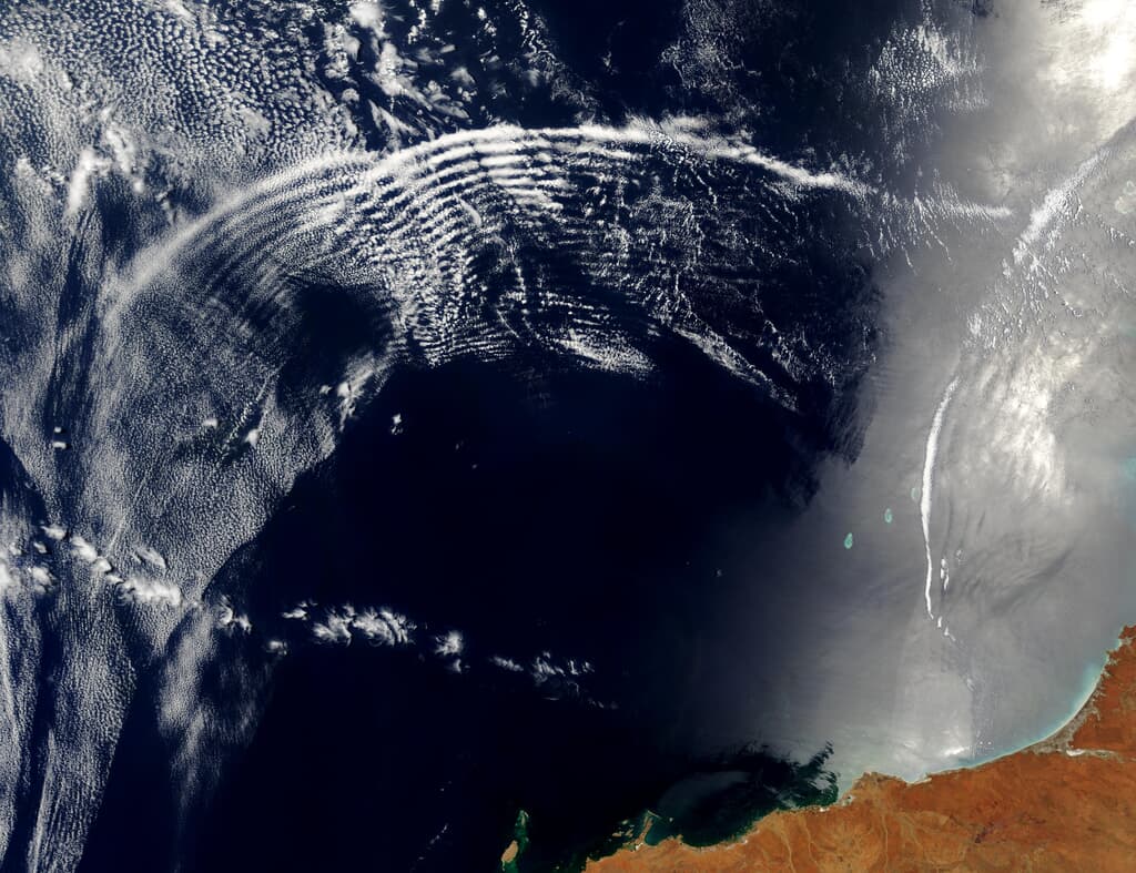 Satellite image showing stripes in clouds from above